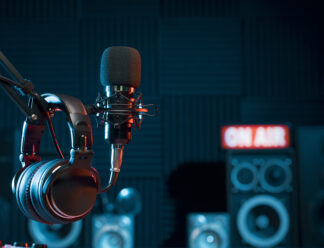 Professional microphone and headphones at the radio station, entertainment and communication concept